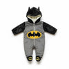 Twinkles Batman fleece baby jumpsuit with hood, featuring a grey body, black sleeves, and yellow logo detail.