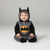 Twinkles baby Batman fleece jumpsuit with hood, featuring black ears, yellow logo, and soft grey lining.