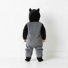 Twinkles baby Batman romper in grey and black fleece with a hooded design featuring small bat ears, back view.