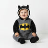 Baby wearing a grey and black Twinkles Batman fleece romper with a hood featuring bat ears and a yellow logo
