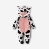 Twinkles baby bunting in a cow print polar fleece with a hooded face, pink chest panel, and enclosed feet.