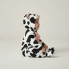 Twinkles baby wearing a soft polar fleece cow-print hooded bunting with pink accents and enclosed feet