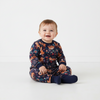 Twinkles baby wearing a navy blue thermal set with a fox and floral print, featuring ribbed cuffs for extra warmth.
