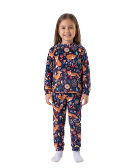 A young girl wearing a Twinkles navy thermal pajama set with a playful fox and floral print and ribbed cuffs.