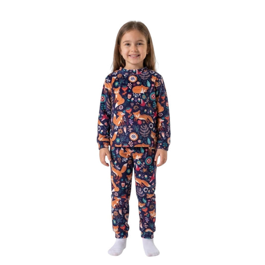 A young girl wearing a Twinkles navy thermal pajama set with a playful fox and floral print and ribbed cuffs.
