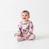 Twinkles baby girl wearing a pink Minnie Mouse print long-sleeve pajama set while sitting on a white background