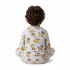Twinkles child wearing grey Simba print pajamas sitting on the floor, back view