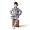 Twinkles grey Stitch print fleece pajama set worn by a young boy sitting on a wooden block