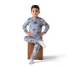 Twinkles grey Stitch print fleece pajama set worn by a young boy sitting on a wooden block