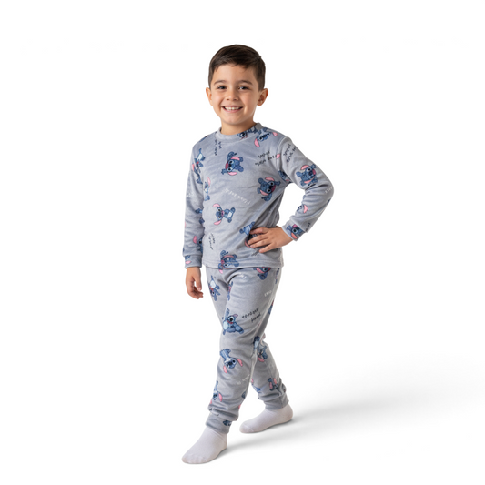 A young boy wearing a grey Twinkles Stitch character print fleece pajama set with long sleeves and matching pants.