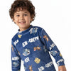 Twinkles blue fleece Tom and Jerry pajama set with mock-neck, worn by a smiling young boy.